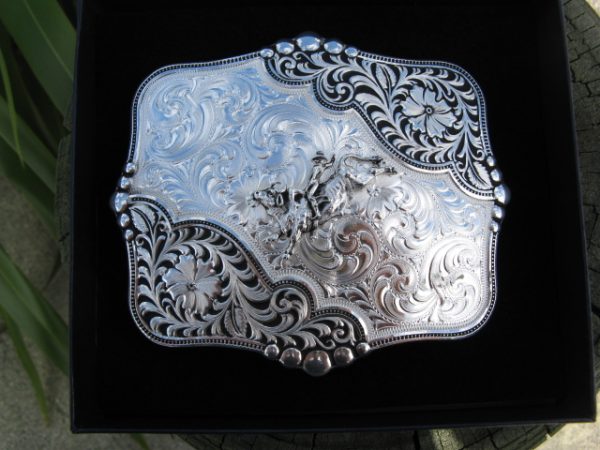 ANTIQUED LEATHERCUT BLOOMS BELT BUCKLE WITH BULL RIDER