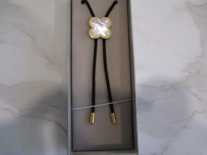 AUSTRALIAN PEARL SHELL AND BRASS BOLO TIE
